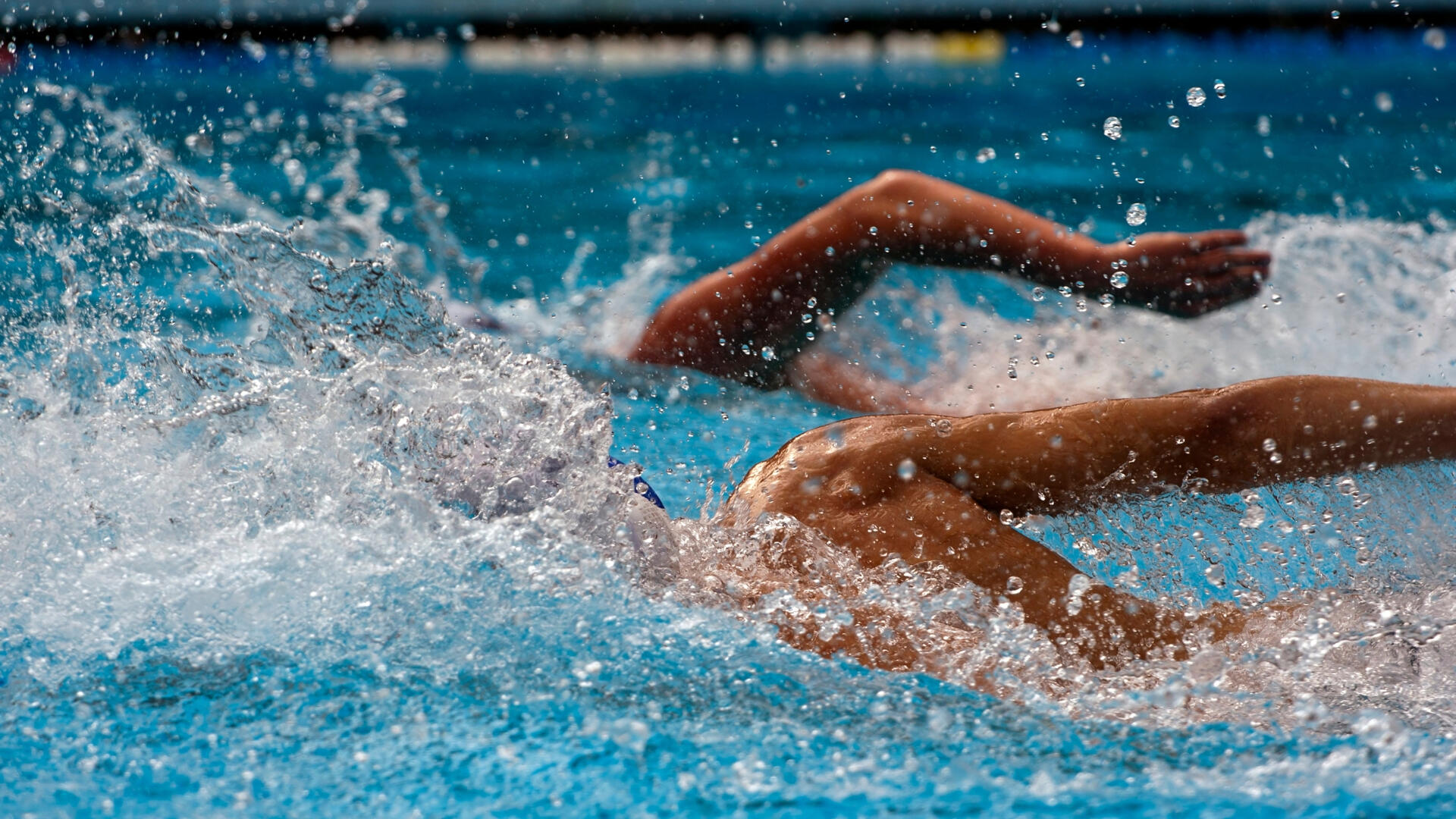 2-man group lessons Two swimmers competing in swimming lessons together.